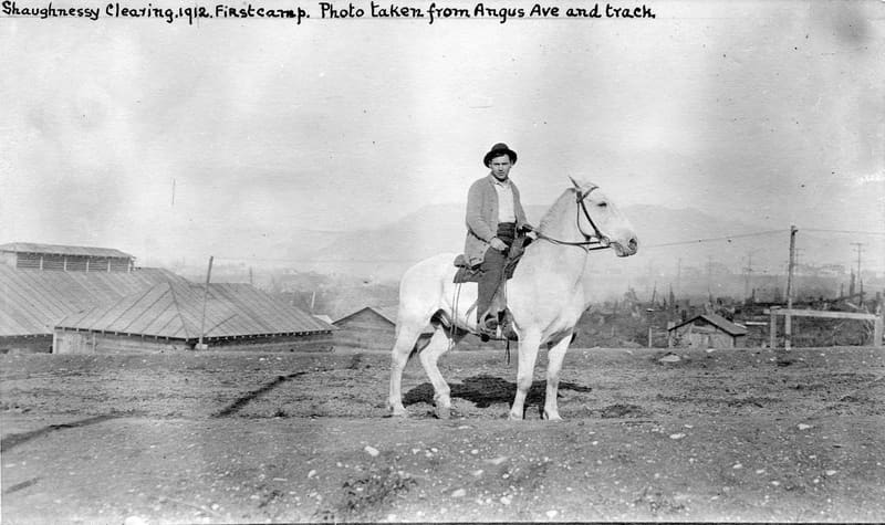 A man on a white horse at the first camp for clearing Shaughnessy, near Angus Drive