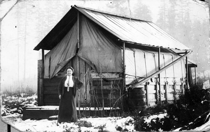 Mrs. Rose Ellen Mitchell in the snow outside a tent house at 29th Avenue and Collingwood Street