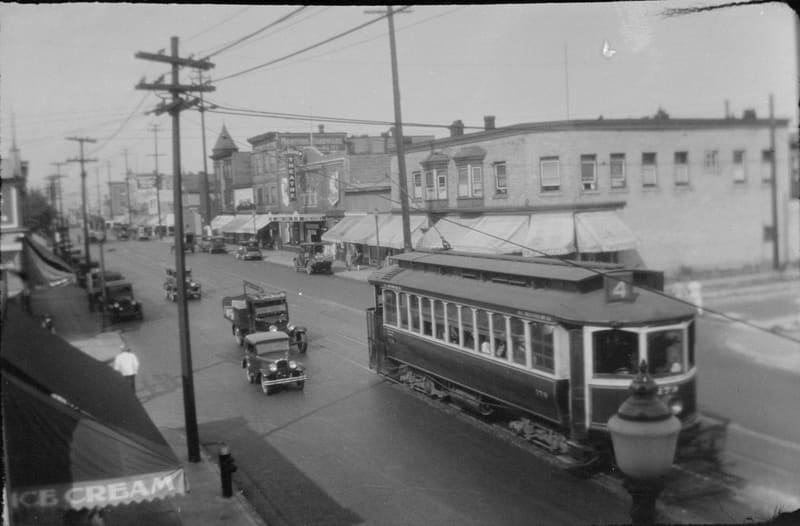 A No. 4 streetcar and traffic on Commercial Drive at 2nd Avenue, looking north along the 1700 block