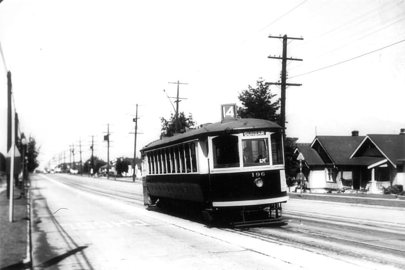 A No. 14 Dunbar streetcar on Dunbar Street, past bungalows