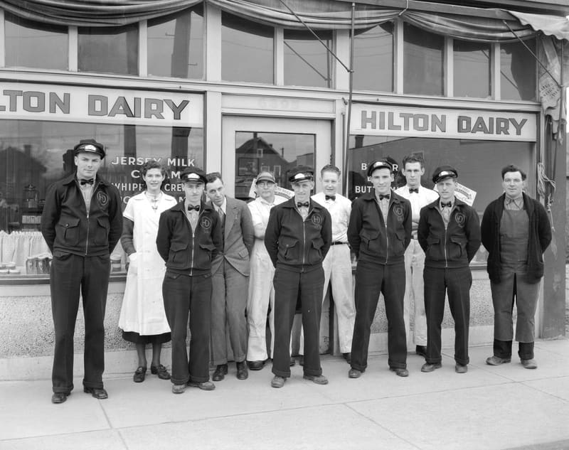 The Hilton Dairy staff lined up outside the dairy at 6395 Fraser Street