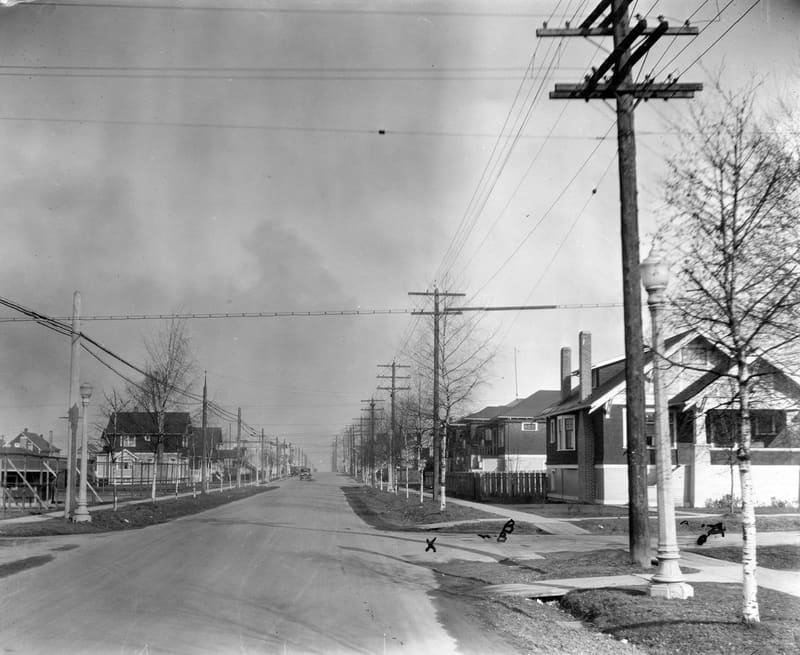 Heather Street at 19th Avenue, looking north past young trees and houses