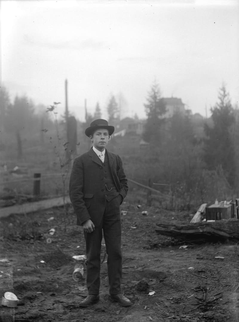 George, a young man in a bowler hat, standing in a yard on Knight Road (now Knight Street) in Cedar Cottage