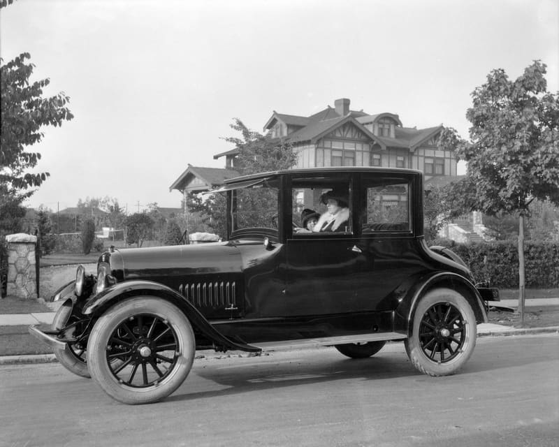 A woman and a child in a car on Matthews Avenue