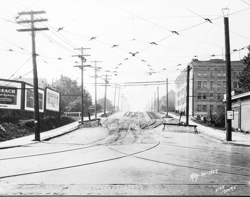 Oak Street at Broadway, looking south past billboards and the Vallejo Court apartments